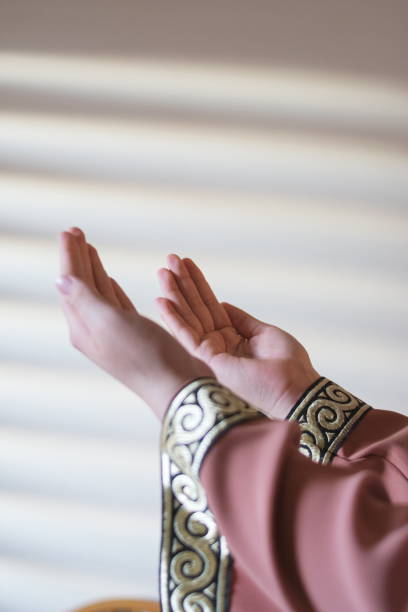 istock Cropped Hands Of Woman Gesturing While Praying At Home 1144297491
