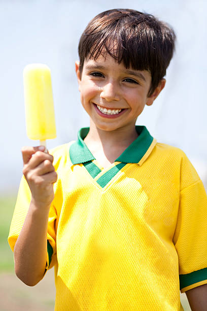 istock Smiling kid holding an ice-cream 114429813