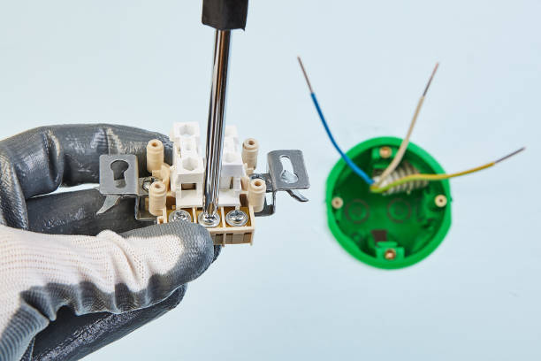 istock Electrician makes new european standard switch. 1144300282