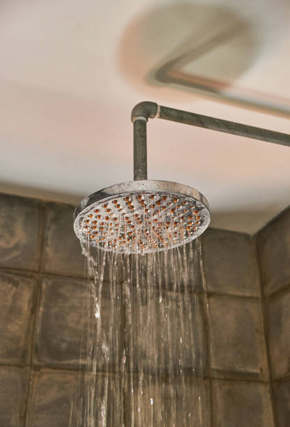 istock Shower in bathroom with water drops flowing 1144300404