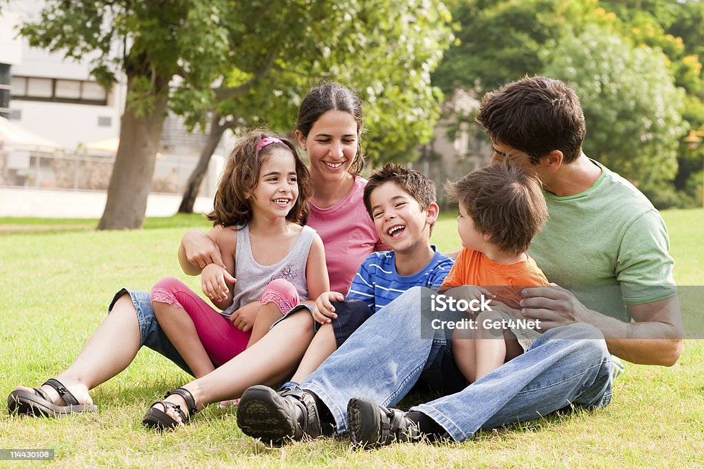 Happy family having fun in the park  Family Stock Photo