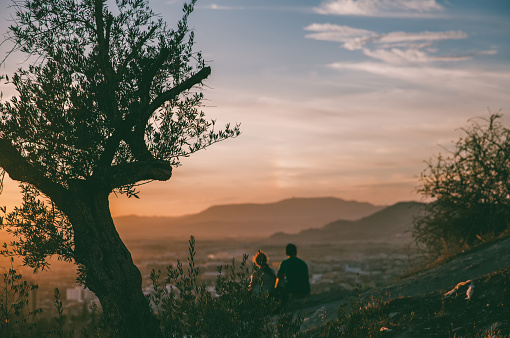 Boy and girl on mountain in Granada,Spain.