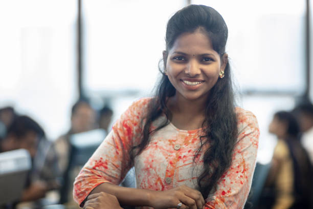 istock Confident young businesswoman standing at office 1144303084
