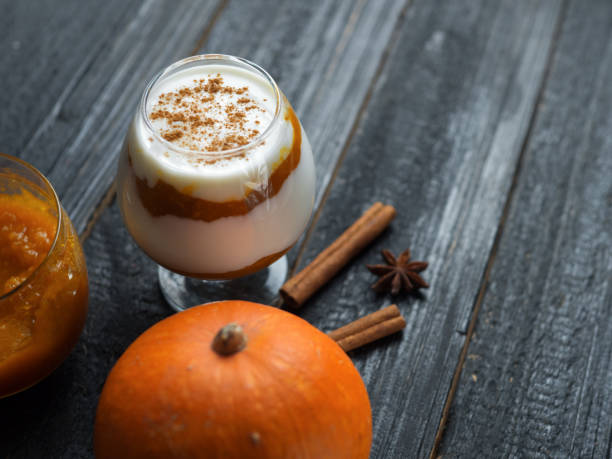 istock Delicious pumpkin parfait on dark wooden background with copyspace 1144307620