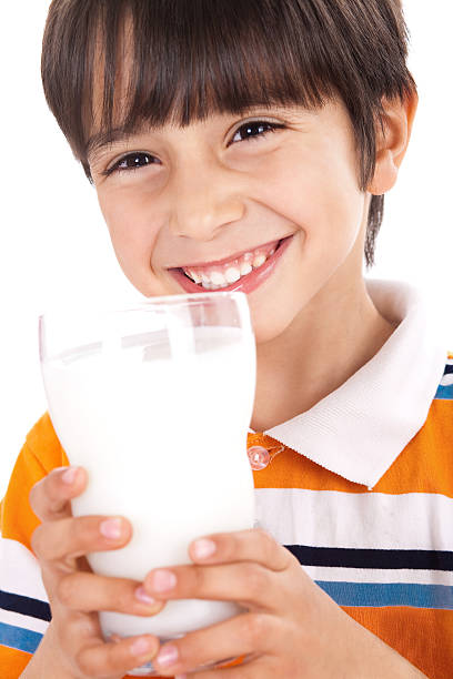istock Happy kid drinking glass of milk 114430828