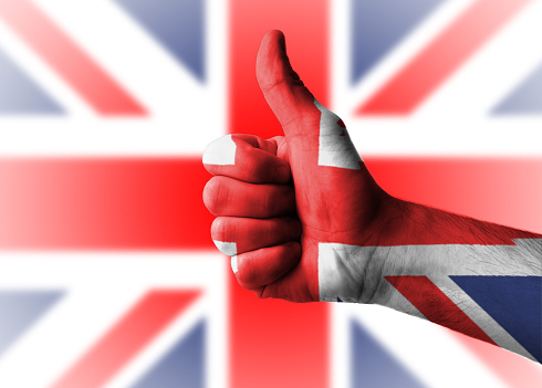 Thumbs up with the Great Britain flag as background