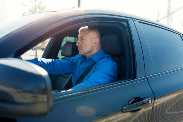 istock Successful businessman at car 1144308879