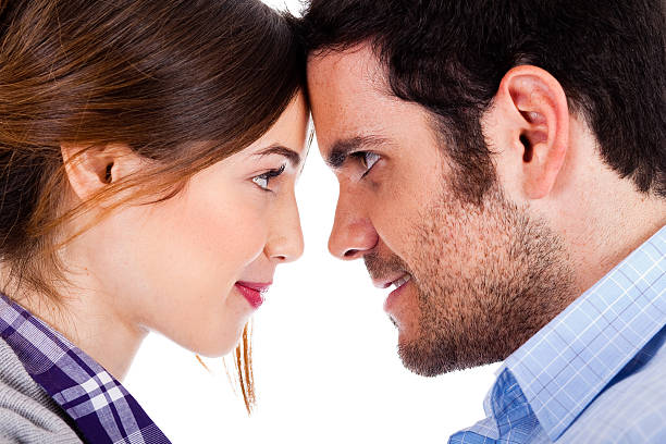 istock Beautiful couple smiling and facing each other 114430982