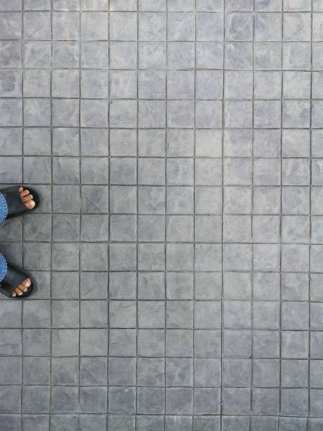 istock Leg stan on​concrete​ Black​ color​ froor block​ pattern​ cement​ material​ rough​ surface​ square shape 1144311199