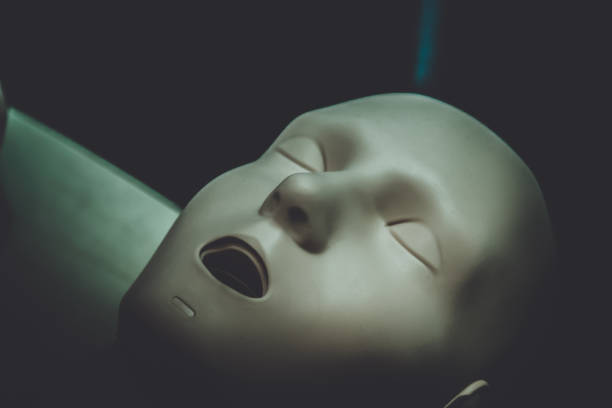 istock One Layout medical mannequin face man with open mouth close-up, 1144311559