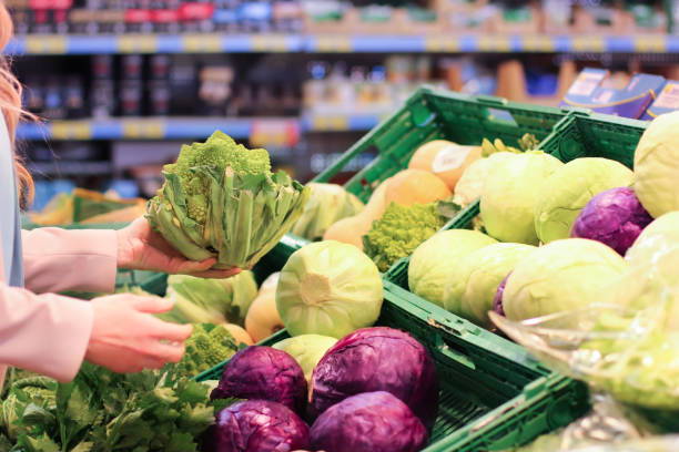 istock Female hand choosing vegetables in the store 1144312090