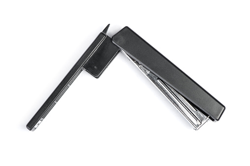 One black stapler isolated on white background