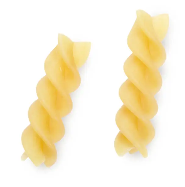 Two raw italian yellow pasta fusilli isolated on white background. Top view.