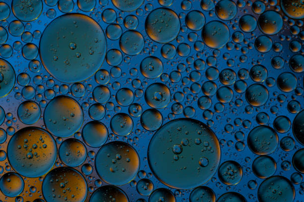 istock Bubbles world color full macro abstract in water surface background 1144313197