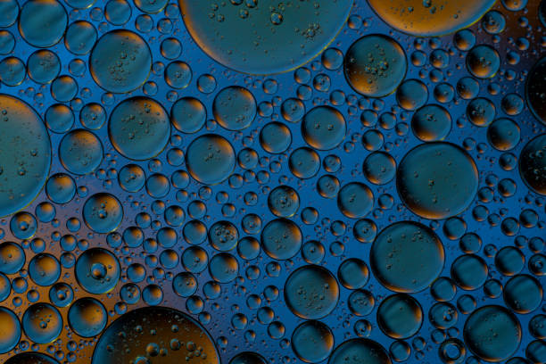 istock Bubbles world color full macro abstract in water surface background 1144313319