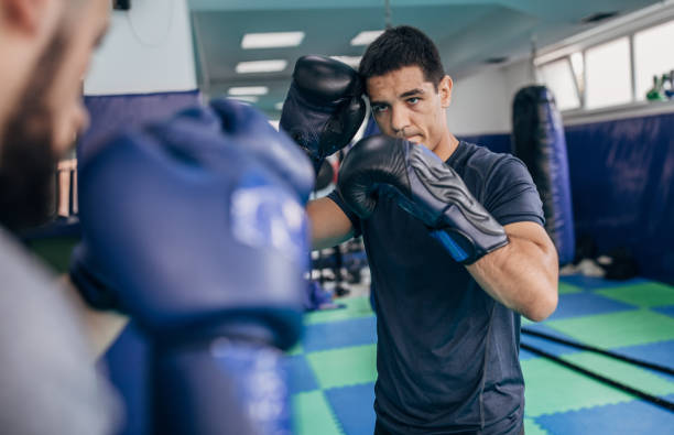 istock Mixed martial arts fighters sparing 1144317172