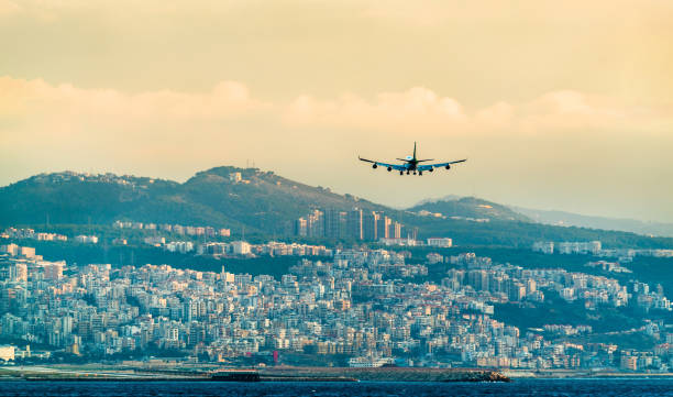 Airplane on final approach to Beirut International Airport, Lebanon Airplane on final approach to Beirut-Rafic Hariri International Airport, Lebanon lebanon beirut stock pictures, royalty-free photos & images