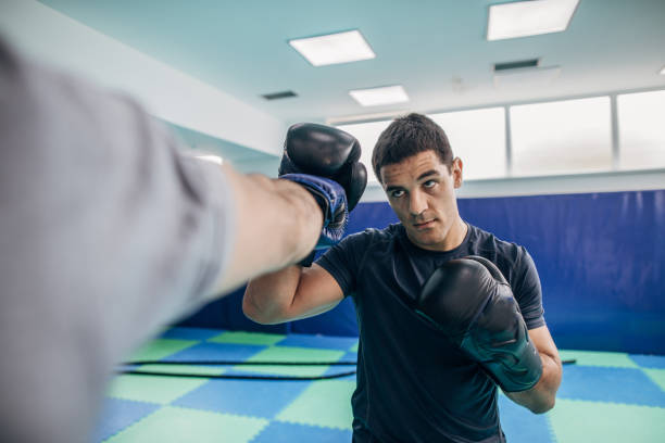 istock Coach training with boxer in gym 1144318624