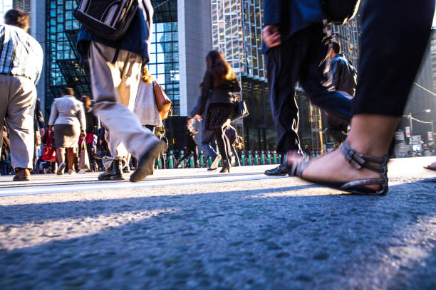 istock Crosswalk, people crossing in downtown 1144320420