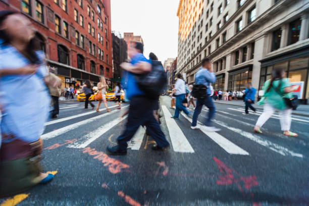 istock Crosswalk, people crossing in downtown 1144320644