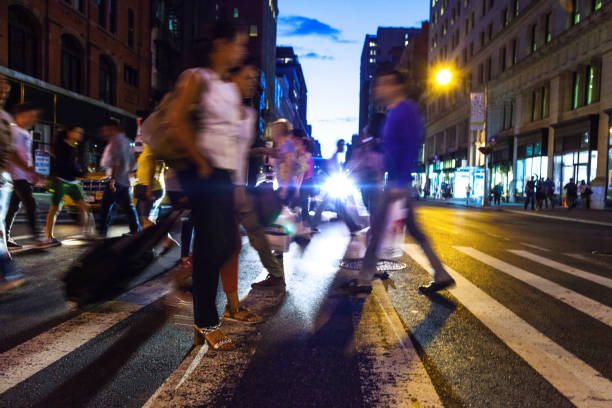istock Crosswalk, people crossing in downtown 1144320646