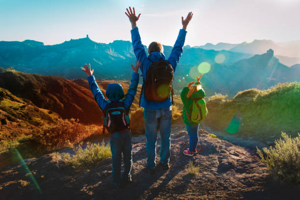 istock Father and kids travel in sunset mountains 1144321900