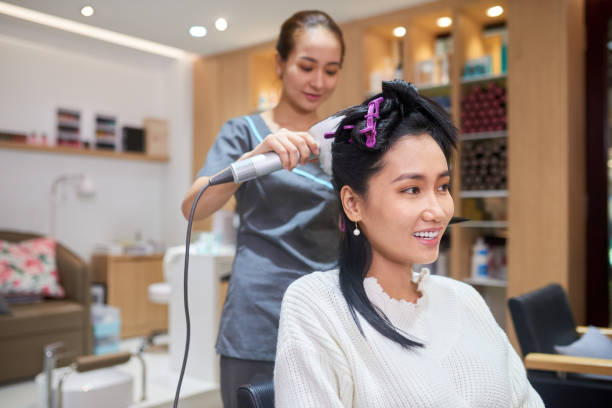 istock Making hairstyle in beauty salon 1144322427