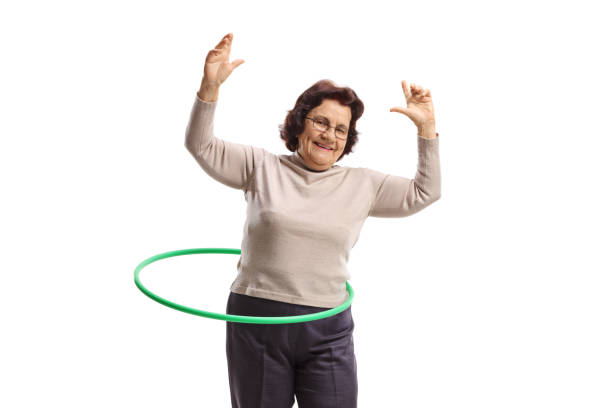 istock Cheerful elderly woman with a hula-hoop 1144327864