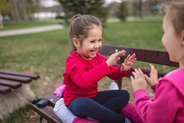 istock Siblings playing around in their favorite local park on a warm spring day 1144329044