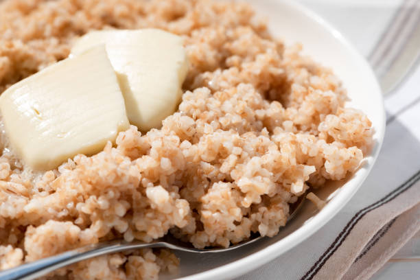 istock Boiled spelt with butter and honey. 1144329064
