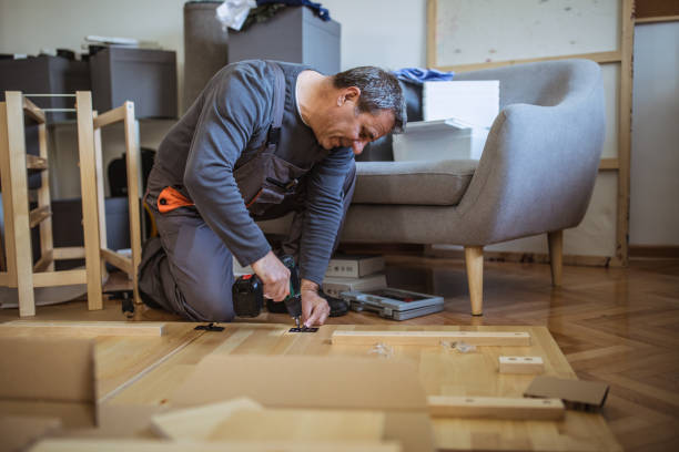 istock The man is assembling furniture from chipboard boards 1144329098