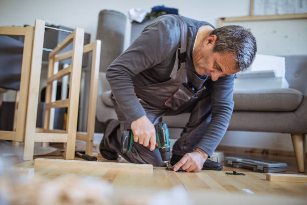 istock The man is assembling furniture from chipboard boards 1144329160