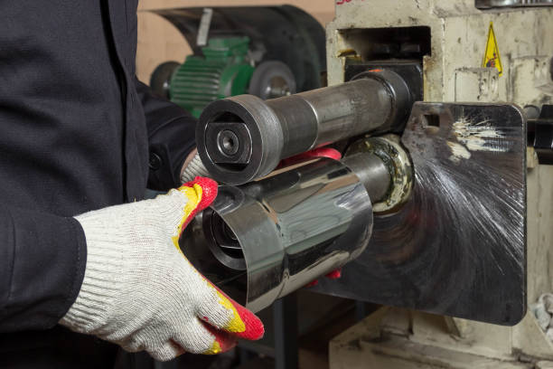 istock Working man produces metal pipe. 1144332613