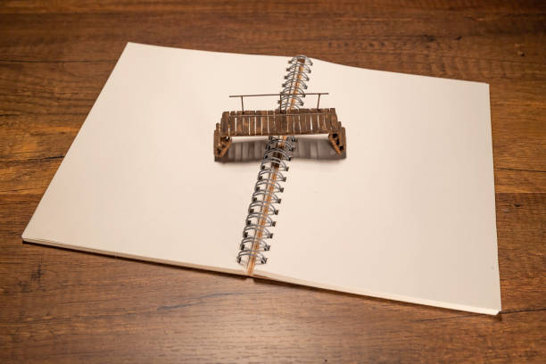 Old wooden bridge on blank notebook stock photo