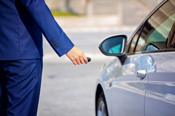 istock Locking or unlocking car door with remote key 1144334023