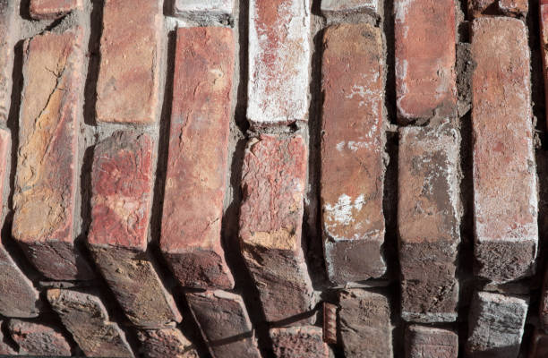 abstraction the texture of the corner of a brick wall is a red color background. - corner stone wall brick imagens e fotografias de stock