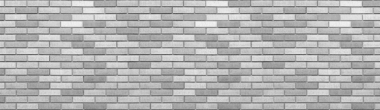 Abstract gray brick wall texture background. Horizontal panoramic view of masonry brick wall for interior design.