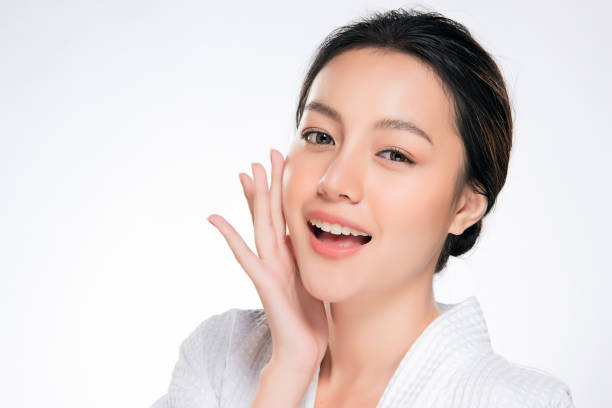 Beautiful Young Woman with Clean Fresh Skin Beautiful Young Woman with Clean Fresh Skin. Face care . Facial treatment . Cosmetology , beauty and spa. Asian women portrait asian beauty woman stock pictures, royalty-free photos & images