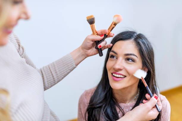 istock Makeup artist preparing bride before the wedding in a morning 1144338881