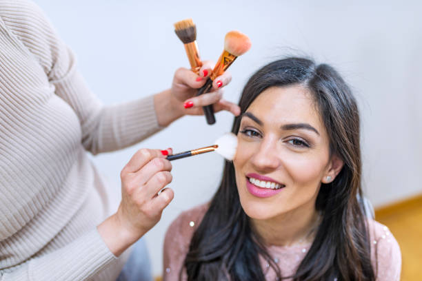 istock Makeup artist preparing bride before the wedding in a morning 1144338907