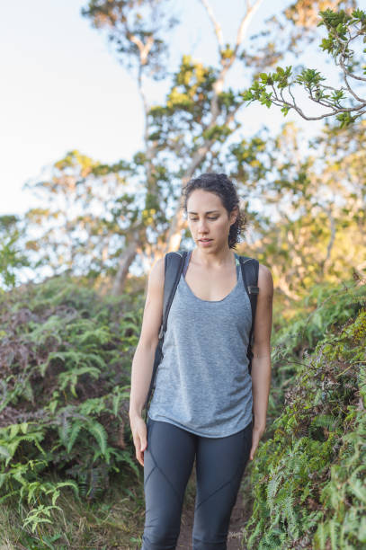 istock Young woman hikes solo in the mountains 1144339049