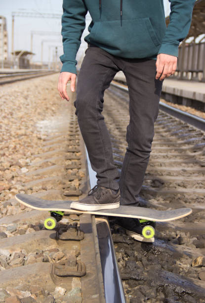 istock drift on a skateboard on the railway rail 1144339226