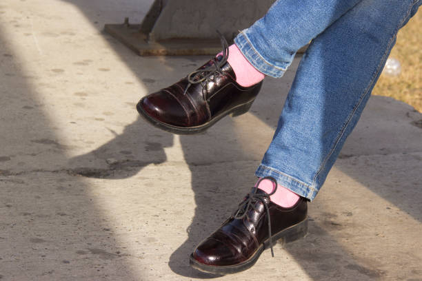 istock Patent leather shoes with stylish pink socks. 1144339281