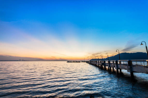 istock Jerejak Pier view during sunrise by the shore of Bayan Mutiara 1144340607