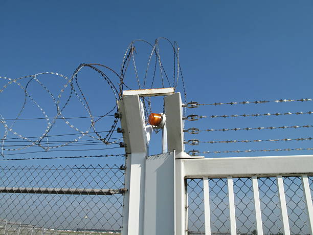 istock Razor Wire Above a Fence 114434099