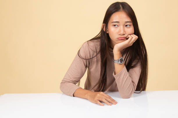 istock Asian girl is getting bore. 1144342049