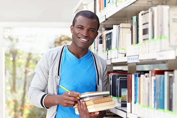 istock young african man smiling in library 114434256