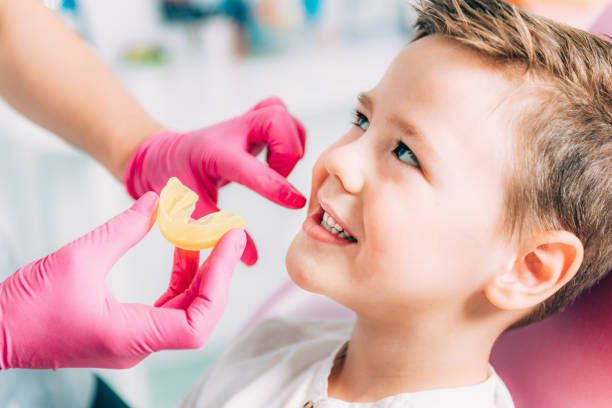 istock Orthodontist working with little boy 1144343758