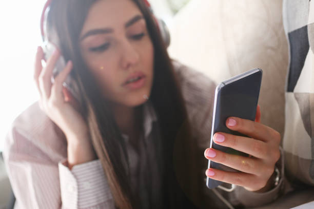 istock Young beautiful woman look camera holds 1144346214