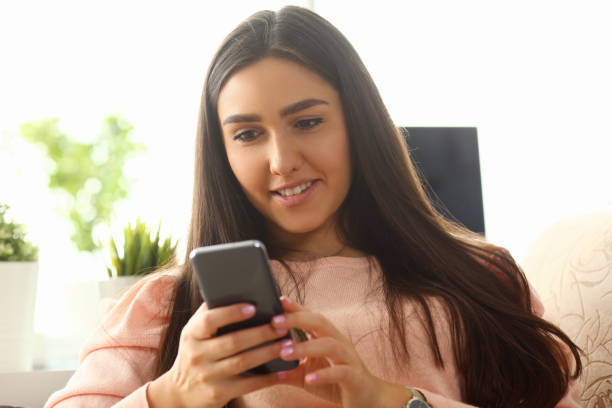 istock Young beautiful woman look camera holds 1144346285